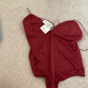 I am selling a women red body suit!